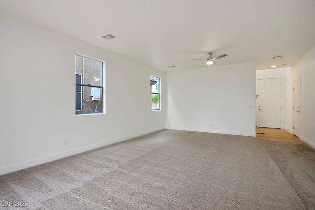 carpeted empty room with ceiling fan