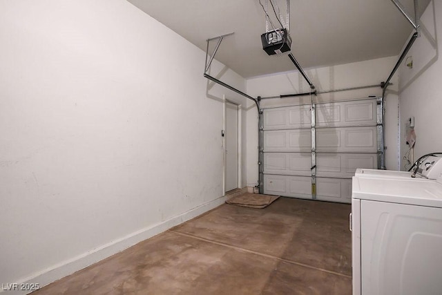 garage featuring separate washer and dryer and a garage door opener