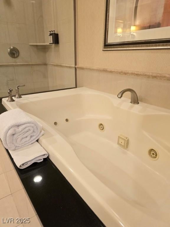 135 E Harmon Ave Unit 2120, Las Vegas, NV 89109 - full bath featuring a tub with jets and tile patterned flooring