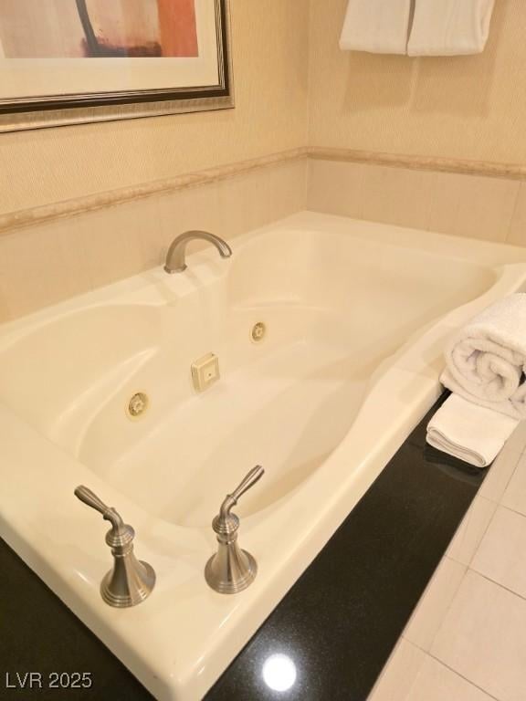 135 E Harmon Ave Unit 2120, Las Vegas, NV 89109 - bathroom featuring tile patterned flooring and a whirlpool tub