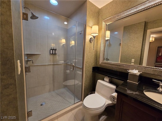 135 E Harmon Ave Unit 2120, Las Vegas, NV 89109 - full bath featuring vanity, tile patterned floors, a shower stall, and toilet