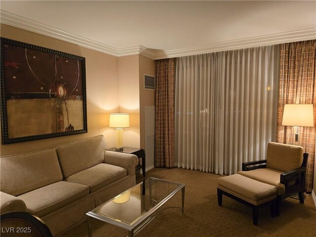135 E Harmon Ave Unit 2120, Las Vegas, NV 89109 - carpeted living room featuring crown molding and visible vents