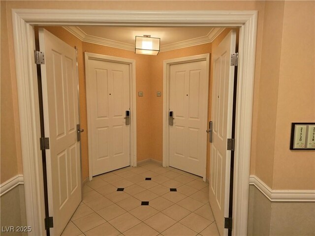 135 E Harmon Ave Unit 2120, Las Vegas, NV 89109 - entryway with light tile patterned flooring and ornamental molding
