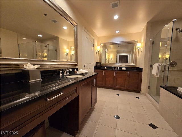 135 E Harmon Ave Unit 2120, Las Vegas, NV 89109 - bathroom with a sink, tile patterned flooring, two vanities, a shower stall, and visible vents