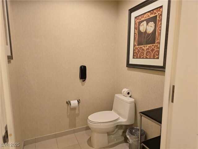 135 E Harmon Ave Unit 2120, Las Vegas, NV 89109 - half bathroom with toilet, tile patterned floors, and baseboards