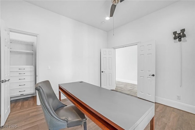 office with hardwood / wood-style floors and ceiling fan