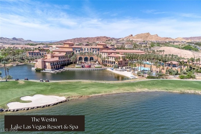 water view with a mountain view and golf course view