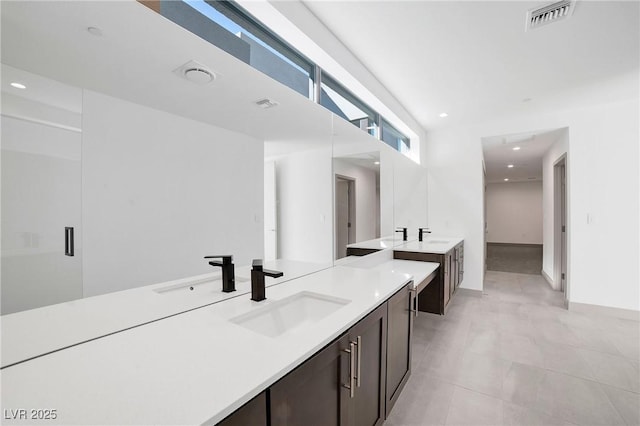 full bath featuring vanity, visible vents, and recessed lighting