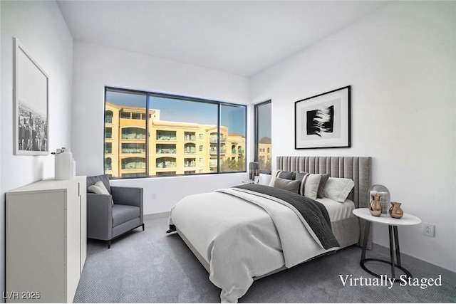 carpeted bedroom featuring baseboards