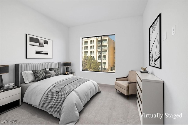 bedroom with light colored carpet