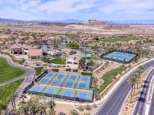 drone / aerial view featuring a residential view and a mountain view