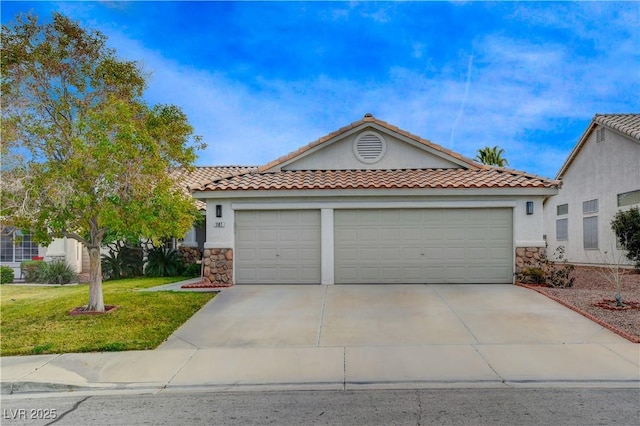 view of front of home featuring a garage and a front lawn