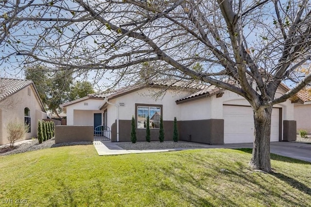 mediterranean / spanish house with a garage and a front lawn