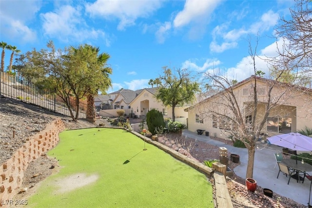 view of property's community with a patio area