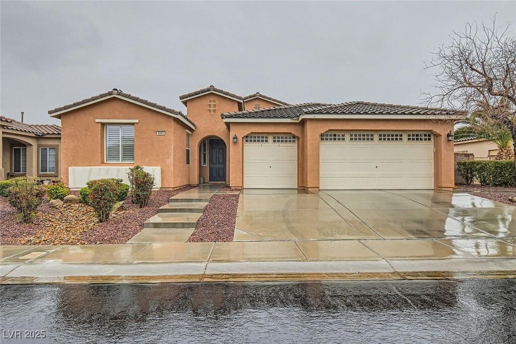 6065 Burleson Ranch Rd, Las Vegas, NV 89131 - mediterranean / spanish home featuring a garage
