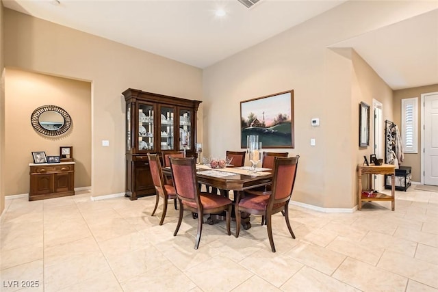 dining area with light tile patterned floors