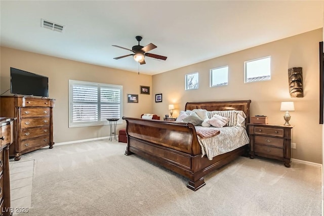 bedroom with ceiling fan and light colored carpet