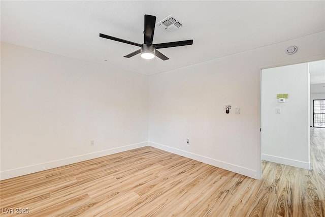 unfurnished room with ceiling fan and light hardwood / wood-style floors