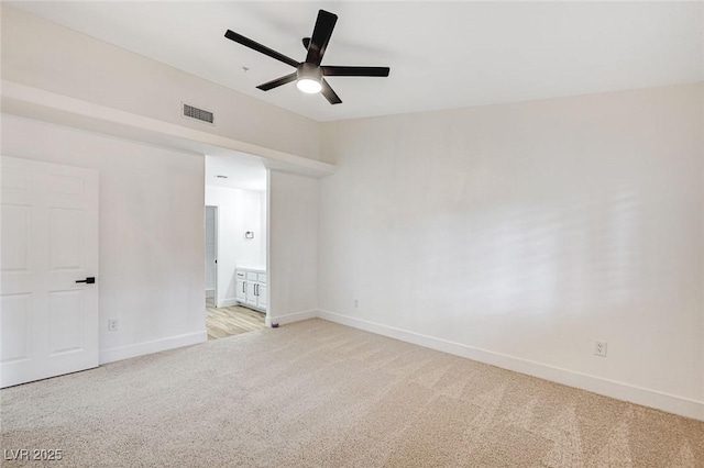 carpeted spare room with ceiling fan