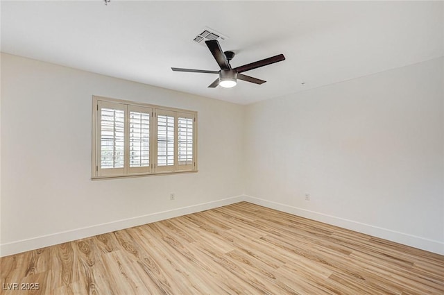 empty room with light hardwood / wood-style flooring and ceiling fan