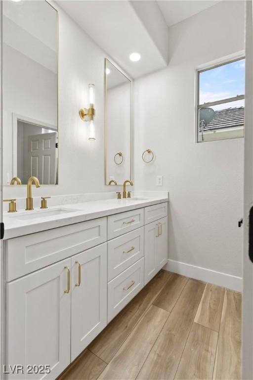 bathroom featuring hardwood / wood-style flooring and vanity