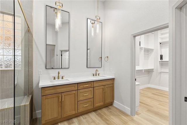 bathroom with vanity, toilet, and hardwood / wood-style floors