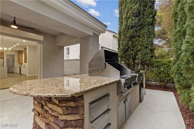 view of patio / terrace featuring area for grilling and a grill