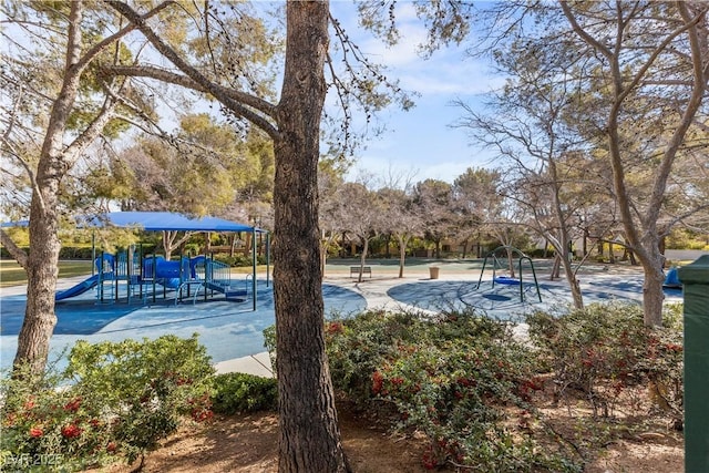 view of swimming pool featuring a playground