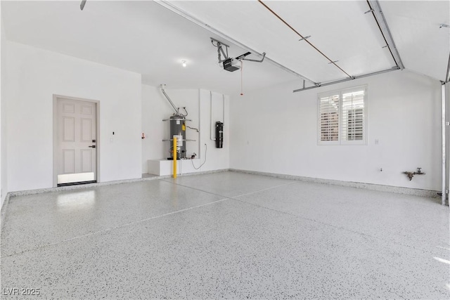 garage with water heater and a garage door opener