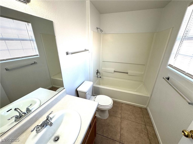 full bathroom with tile patterned floors, toilet, vanity, and tub / shower combination