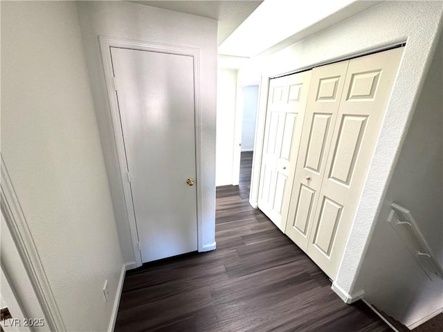 corridor featuring dark hardwood / wood-style floors