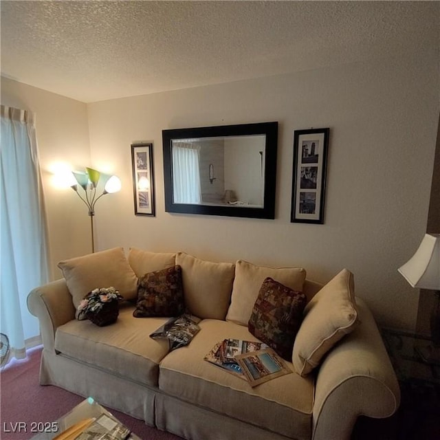 carpeted living room featuring a textured ceiling