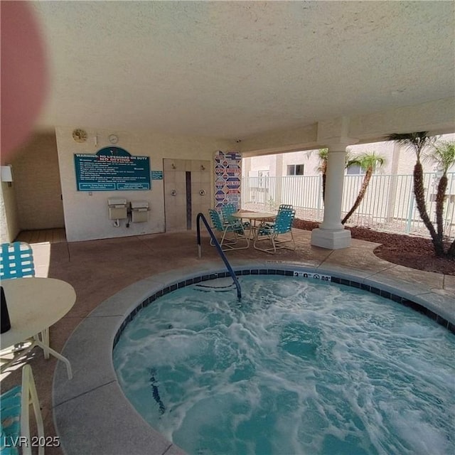 view of pool featuring an indoor hot tub