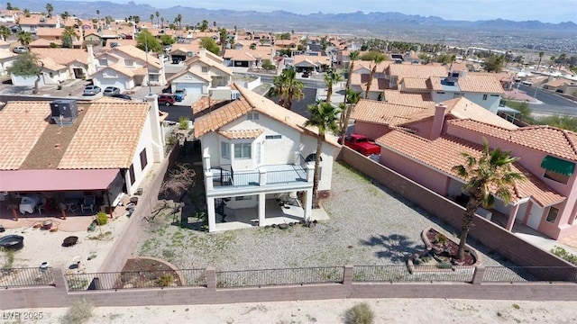 birds eye view of property with a mountain view