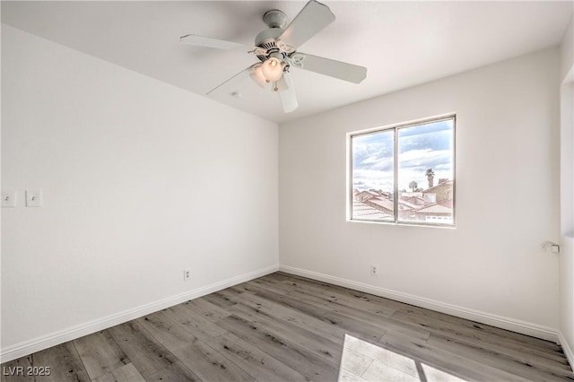 spare room with ceiling fan and light hardwood / wood-style flooring