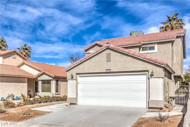 mediterranean / spanish-style house featuring a garage