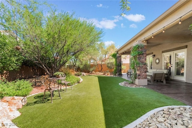 view of yard featuring an outdoor living space and a patio area