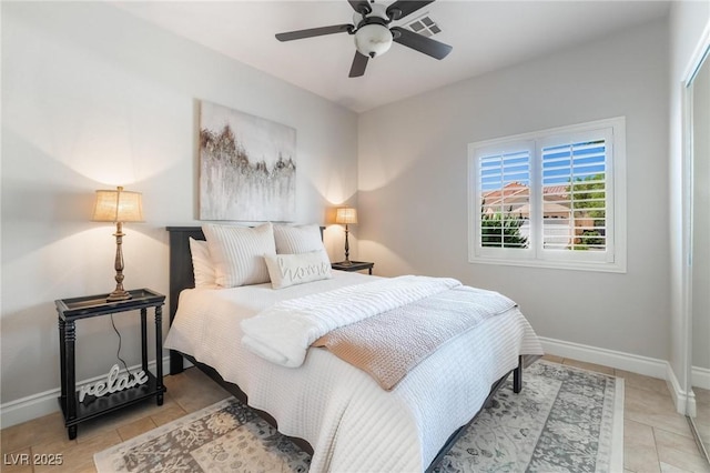 bedroom featuring ceiling fan and light tile patterned flooring