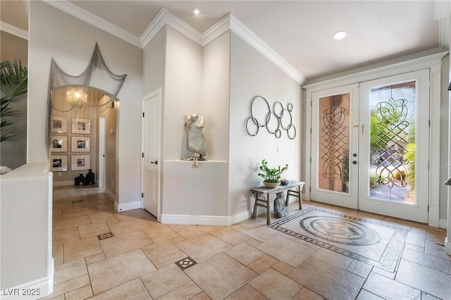 entryway featuring crown molding and french doors