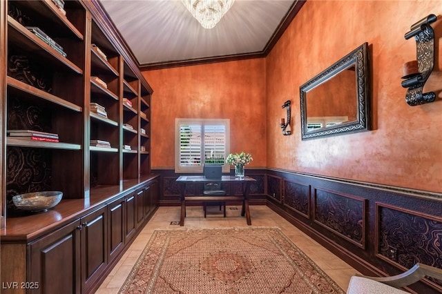 tiled office space featuring crown molding and a chandelier