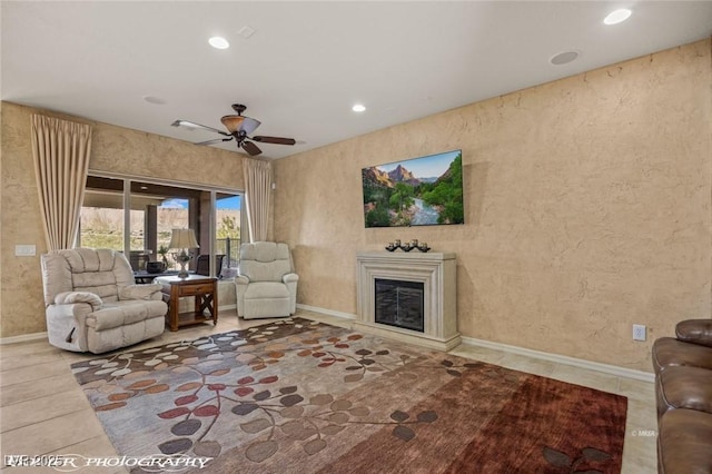 living room featuring tile patterned floors and ceiling fan