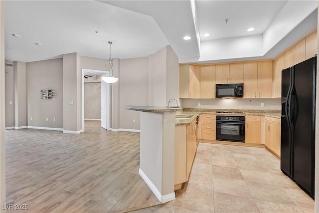 kitchen featuring sink, light stone countertops, black appliances, kitchen peninsula, and light brown cabinets