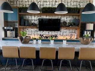 2379 Albury Ave, North Las Vegas, NV 89086 - bar area with decorative light fixtures