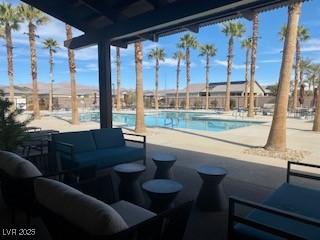 2379 Albury Ave, North Las Vegas, NV 89086 - community pool with a patio and an outdoor living space
