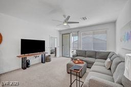 2379 Albury Ave, North Las Vegas, NV 89086 - carpeted living area with a ceiling fan