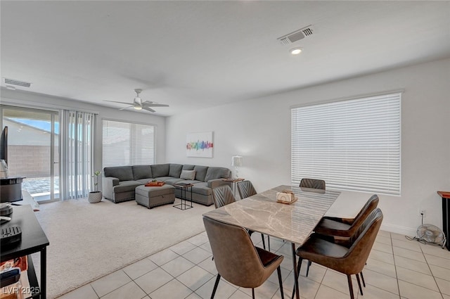 2379 Albury Ave, North Las Vegas, NV 89086 - dining space with light tile patterned floors, a ceiling fan, and light colored carpet