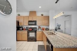2379 Albury Ave, North Las Vegas, NV 89086 - kitchen with black appliances, a peninsula, light brown cabinets, light stone countertops, and recessed lighting