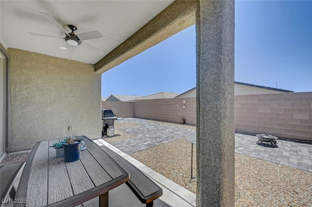 2379 Albury Ave, North Las Vegas, NV 89086 - fenced backyard with a patio, area for grilling, and ceiling fan