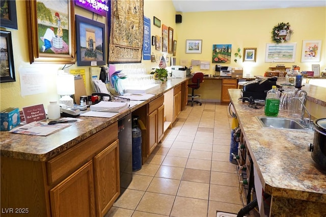 kitchen with sink and light tile patterned floors