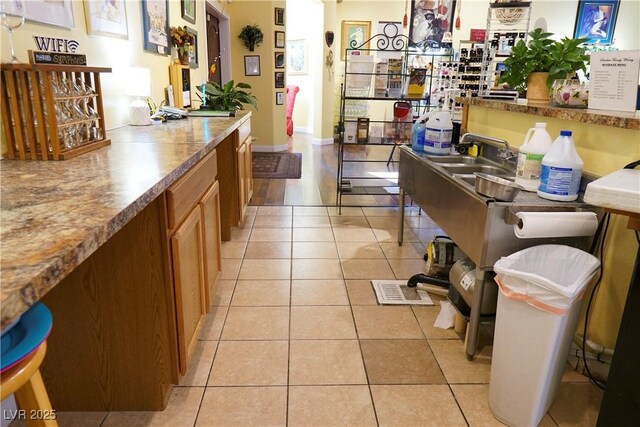 kitchen with light tile patterned floors